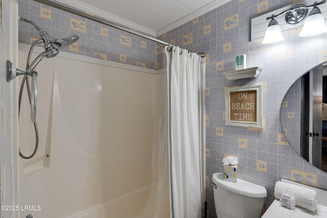 full bathroom featuring toilet, curtained shower, ornamental molding, and tile walls