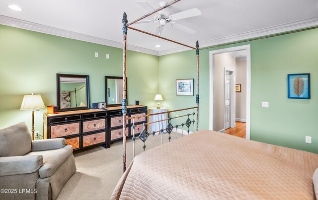 carpeted bedroom with ornamental molding