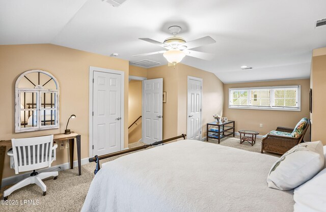 carpeted bedroom with vaulted ceiling and ceiling fan