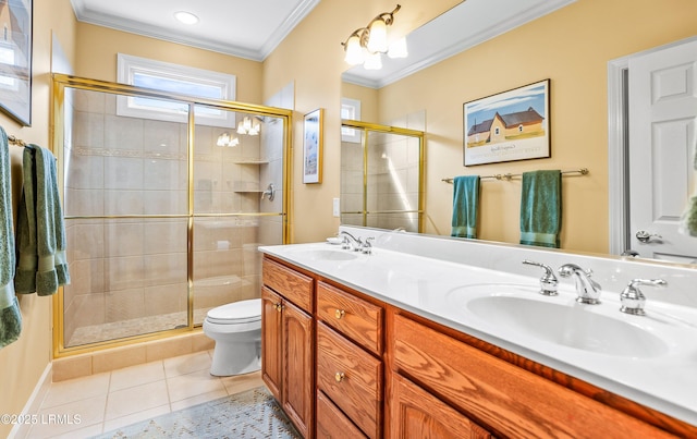 bathroom featuring crown molding, vanity, a shower with shower door, tile patterned floors, and toilet