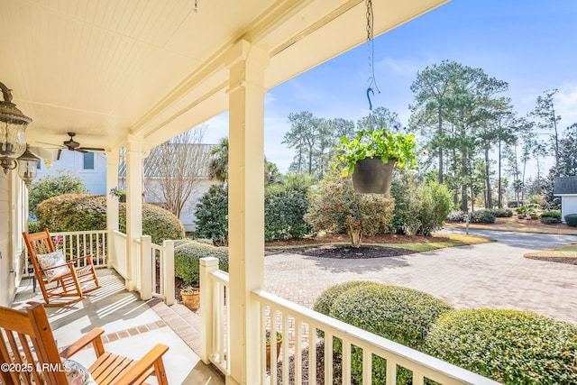 view of patio / terrace with ceiling fan and a porch