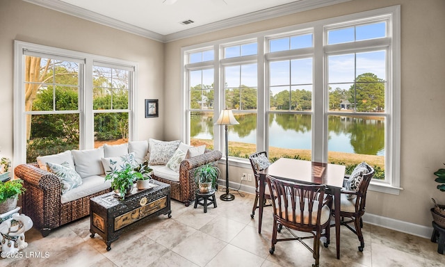 sunroom featuring a water view and plenty of natural light