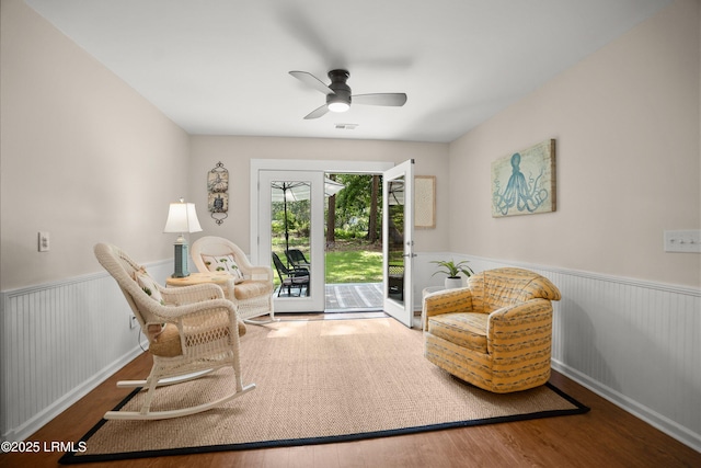 24 Thomas Sumter St, Beaufort, SC 29907 - living area with wainscoting, wood finished floors, and a ceiling fan