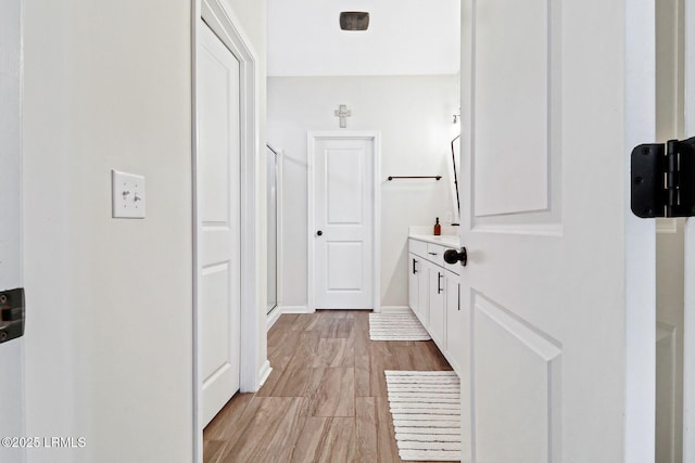 corridor featuring light hardwood / wood-style flooring