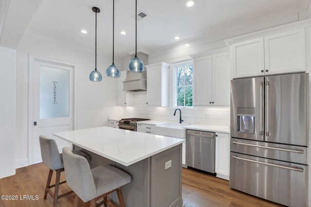 home office featuring ornamental molding and light hardwood / wood-style flooring