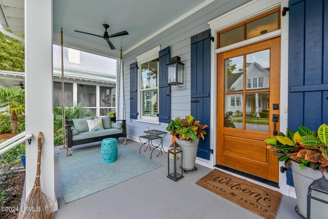 dining space with decorative columns, ornamental molding, and light hardwood / wood-style flooring