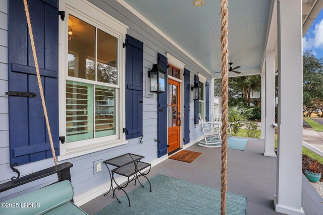 dining space with crown molding, light hardwood / wood-style floors, decorative columns, and a notable chandelier