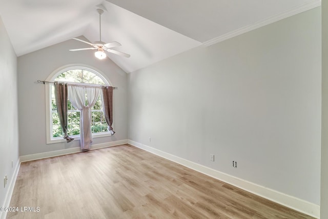 unfurnished room featuring ceiling fan, vaulted ceiling, and light wood-type flooring