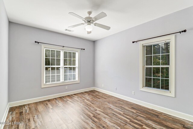 spare room with ceiling fan and hardwood / wood-style floors