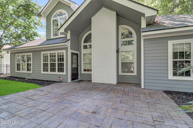 property entrance featuring a patio area