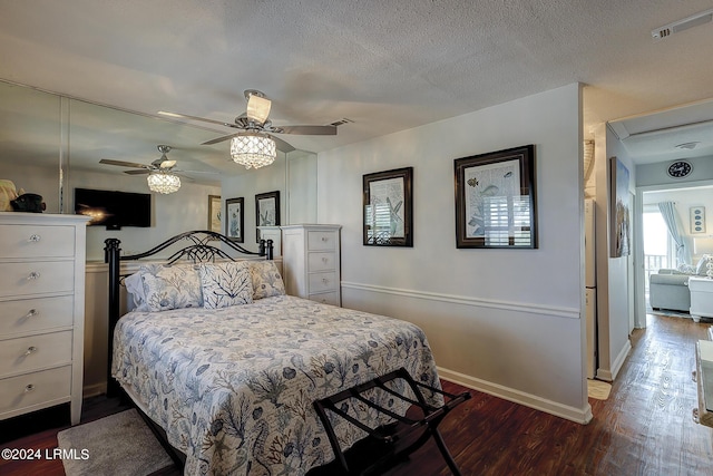 bedroom with wood-type flooring, a textured ceiling, and ceiling fan