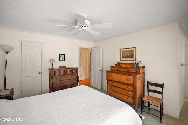 905 Gull Cv, Fripp Island, SC 29920 - bedroom featuring carpet, ornamental molding, a ceiling fan, and a textured ceiling