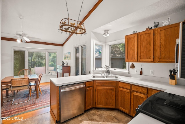 905 Gull Cv, Fripp Island, SC 29920 - kitchen featuring dishwasher, lofted ceiling, plenty of natural light, light countertops, and brown cabinets