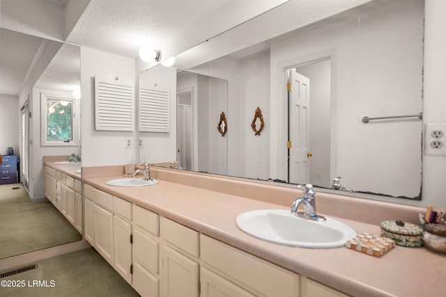 905 Gull Cv, Fripp Island, SC 29920 - bathroom featuring double vanity and a textured ceiling