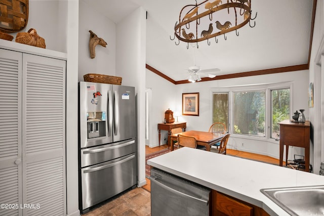 905 Gull Cv, Fripp Island, SC 29920 - kitchen with stainless steel appliances, lofted ceiling, light countertops, ceiling fan, and ornamental molding