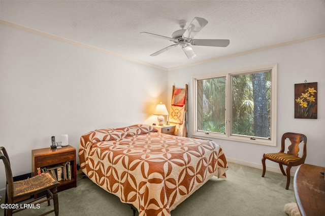 905 Gull Cv, Fripp Island, SC 29920 - bedroom with carpet, crown molding, a textured ceiling, and ceiling fan