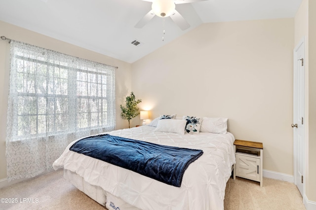 bedroom with visible vents, baseboards, carpet flooring, lofted ceiling, and ceiling fan