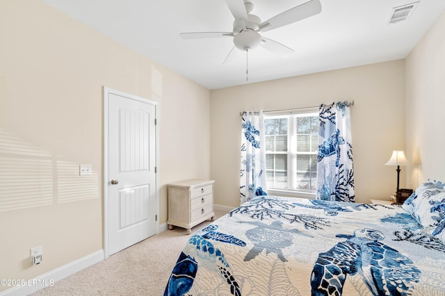 bedroom with visible vents, light colored carpet, a ceiling fan, and baseboards