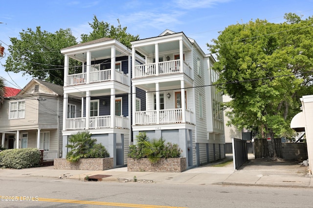 142 President St, Charleston, SC 29403 - view of front facade with a balcony and covered porch