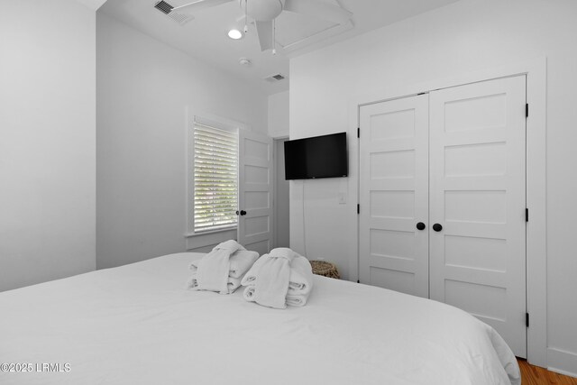142 President St, Charleston, SC 29403 - bedroom featuring a closet, wood finished floors, and a ceiling fan