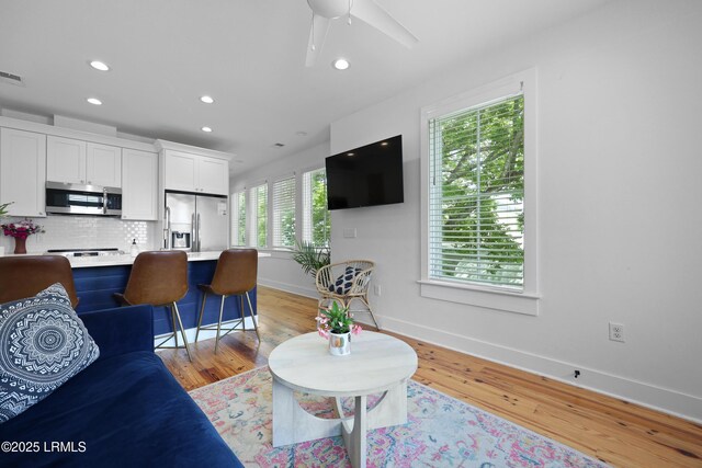 142 President St, Charleston, SC 29403 - living room with baseboards, recessed lighting, light wood finished floors, and a ceiling fan