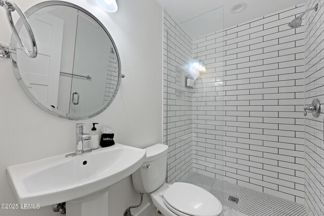 142 President St, Charleston, SC 29403 - bathroom featuring a shower stall, a sink, and toilet