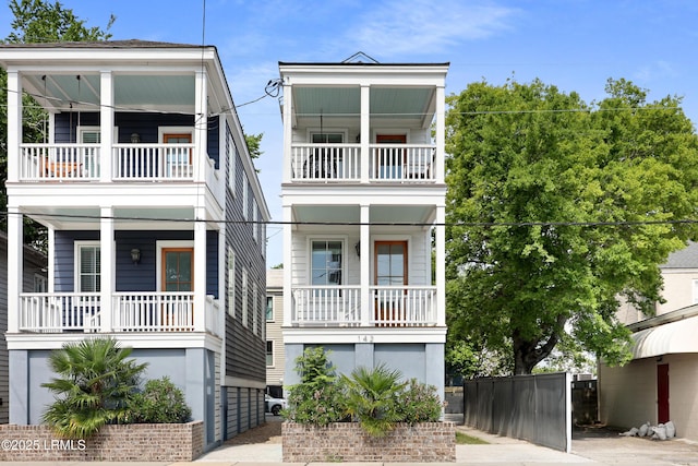 142 President St, Charleston, SC 29403 - raised beach house with a balcony and a porch