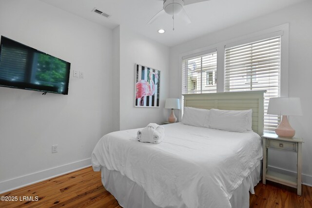 142 President St, Charleston, SC 29403 - bedroom with baseboards, wood finished floors, and a ceiling fan