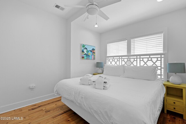 142 President St, Charleston, SC 29403 - bedroom with wood finished floors, baseboards, and a ceiling fan