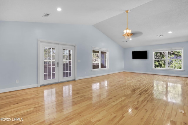 1812 Dolphin Row Dr, Beaufort, SC 29906 - unfurnished living room featuring light wood finished floors, lofted ceiling, baseboards, french doors, and a ceiling fan