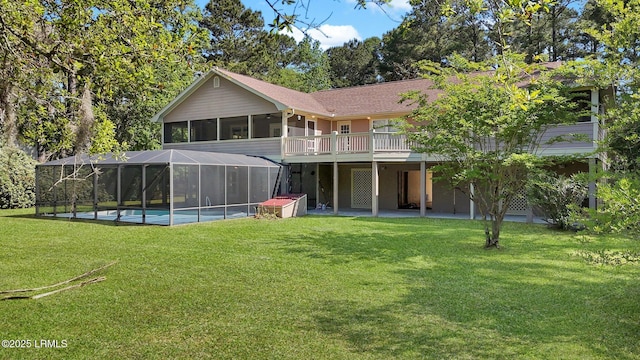 1812 Dolphin Row Dr, Beaufort, SC 29906 - rear view of house with a sunroom, a patio, a lawn, an outdoor pool, and a wooden deck