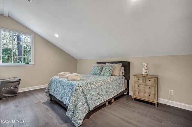 bedroom with baseboards, dark wood-style flooring, and vaulted ceiling