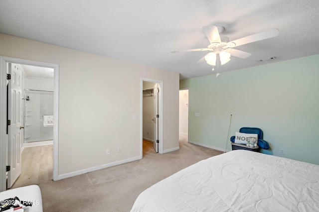 4 Moultrie Ct, Beaufort, SC 29907 - bedroom featuring light carpet, baseboards, ensuite bathroom, a walk in closet, and ceiling fan