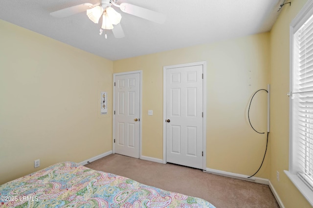 4 Moultrie Ct, Beaufort, SC 29907 - carpeted bedroom featuring baseboards, multiple windows, and ceiling fan