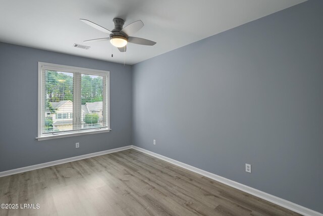 269 Ceasar Pl, Hilton Head Island, SC 29926 - spare room with wood finished floors, ceiling fan, and baseboards