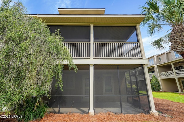269 Ceasar Pl, Hilton Head Island, SC 29926 - rear view of property with a sunroom and a balcony