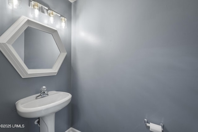 269 Ceasar Pl, Hilton Head Island, SC 29926 - bathroom featuring baseboards and a sink