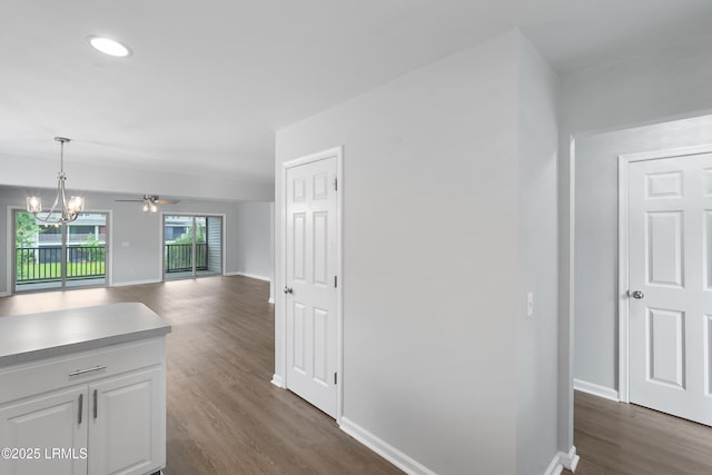 269 Ceasar Pl, Hilton Head Island, SC 29926 - hall with dark wood finished floors, baseboards, and a chandelier