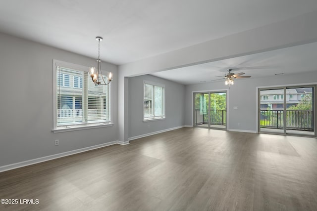 269 Ceasar Pl, Hilton Head Island, SC 29926 - unfurnished room with a chandelier, wood finished floors, baseboards, and a ceiling fan