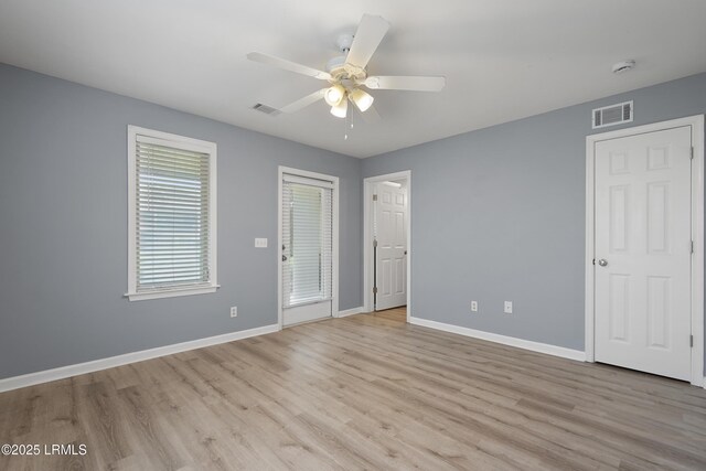 269 Ceasar Pl, Hilton Head Island, SC 29926 - unfurnished bedroom with light wood-type flooring, baseboards, and a ceiling fan