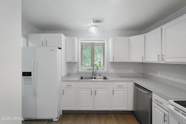 269 Ceasar Pl, Hilton Head Island, SC 29926 - kitchen featuring white fridge with ice dispenser, dishwasher, a sink, white cabinetry, and light countertops