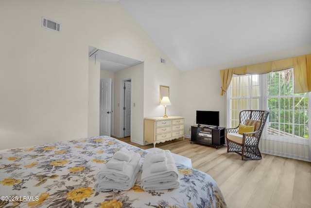 70 Shipyard Dr Unit 166, Hilton Head Island, SC 29928 - bedroom with light wood finished floors and high vaulted ceiling