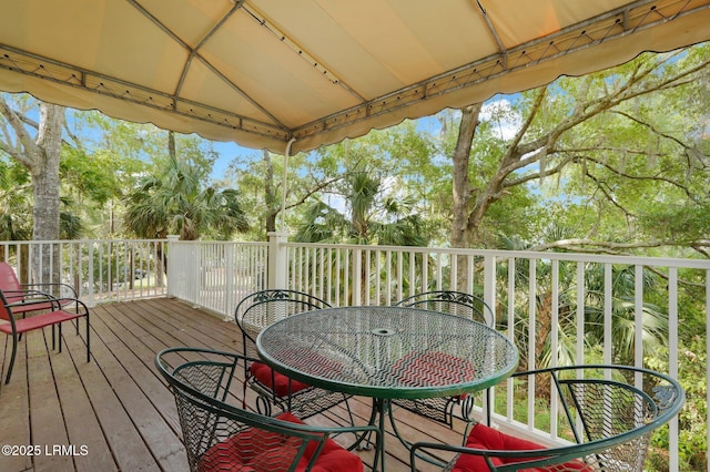70 Shipyard Dr Unit 166, Hilton Head Island, SC 29928 - wooden terrace with view of scattered trees