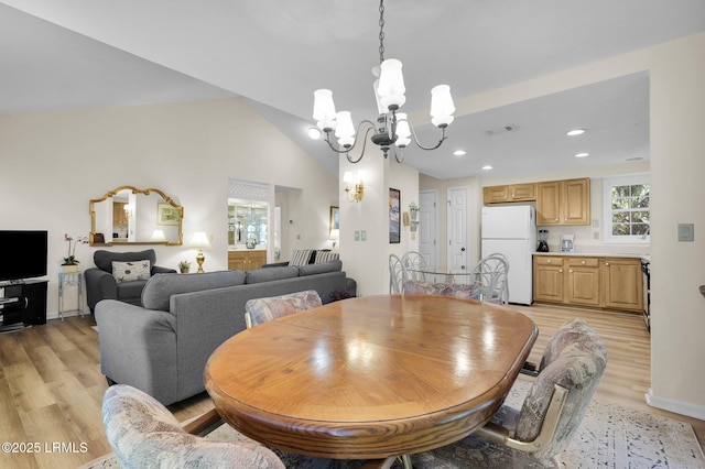 70 Shipyard Dr Unit 166, Hilton Head Island, SC 29928 - dining room with a chandelier, light wood finished floors, recessed lighting, and lofted ceiling