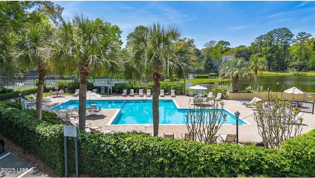 70 Shipyard Dr Unit 166, Hilton Head Island, SC 29928 - community pool with a patio area, fence, a water view, and view of scattered trees