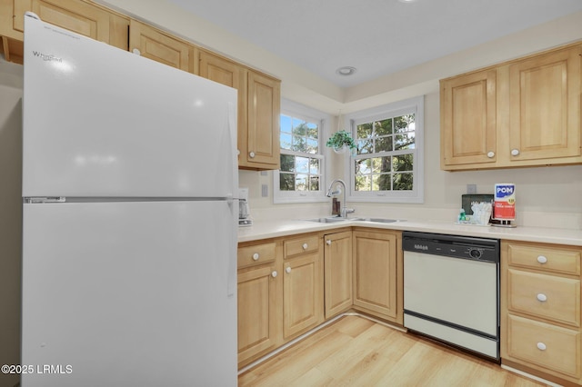70 Shipyard Dr Unit 166, Hilton Head Island, SC 29928 - kitchen featuring white appliances, a sink, light wood-style floors, and light countertops
