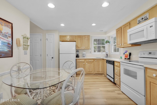 70 Shipyard Dr Unit 166, Hilton Head Island, SC 29928 - kitchen with white appliances, a sink, light brown cabinets, light wood finished floors, and light countertops