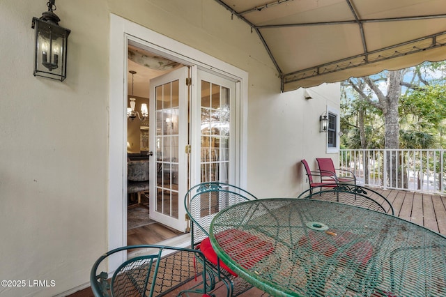 70 Shipyard Dr Unit 166, Hilton Head Island, SC 29928 - balcony with outdoor dining space and french doors