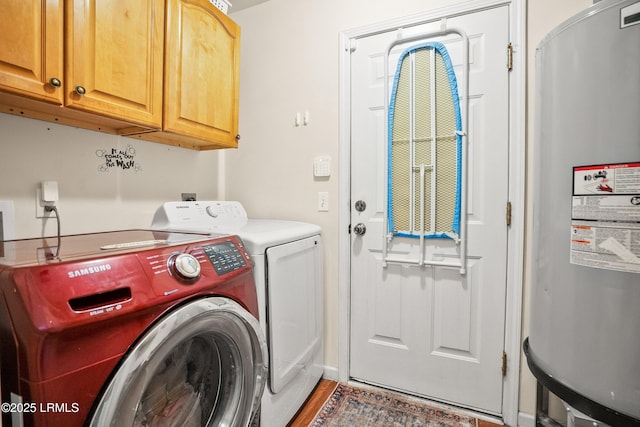 106 Winyah Way, Beaufort, SC 29906 - laundry area featuring washing machine and clothes dryer, cabinet space, electric water heater, and wood finished floors