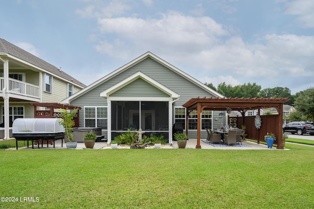 back of property featuring a patio, a lawn, a pergola, a hot tub, and a sunroom